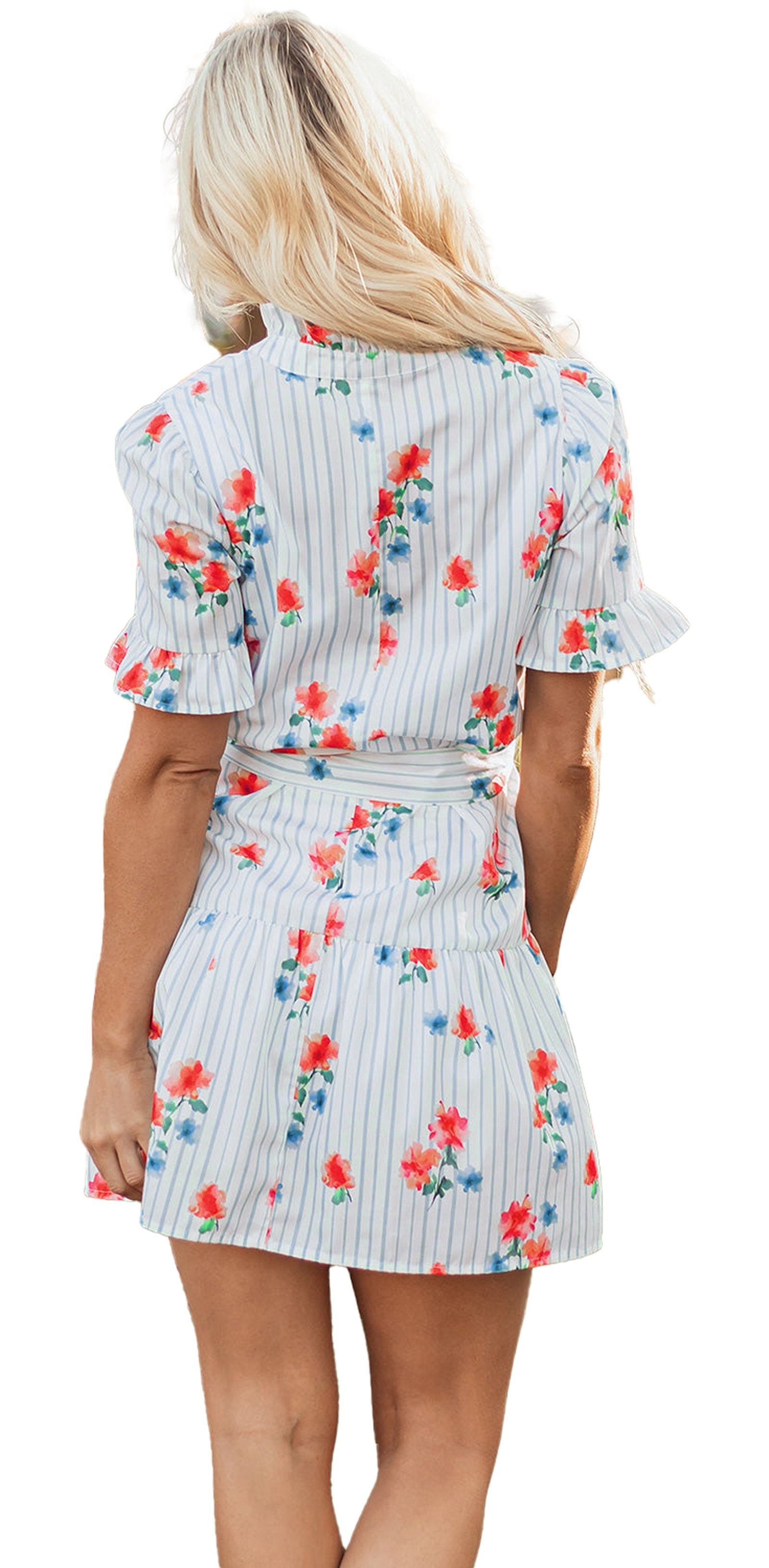 Back view of model in LuckeLadybug sky blue floral mini dress with ruffle sleeves and tie waist in garden