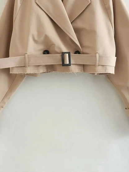Belted cropped trench jacket women in beige with stylish double-breasted design and adjustable waist belt