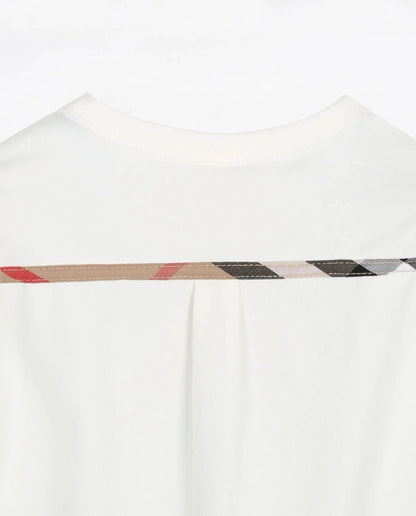 Back view of a baby plaid romper with decorative stitching in neutral colors for stylish baby clothes