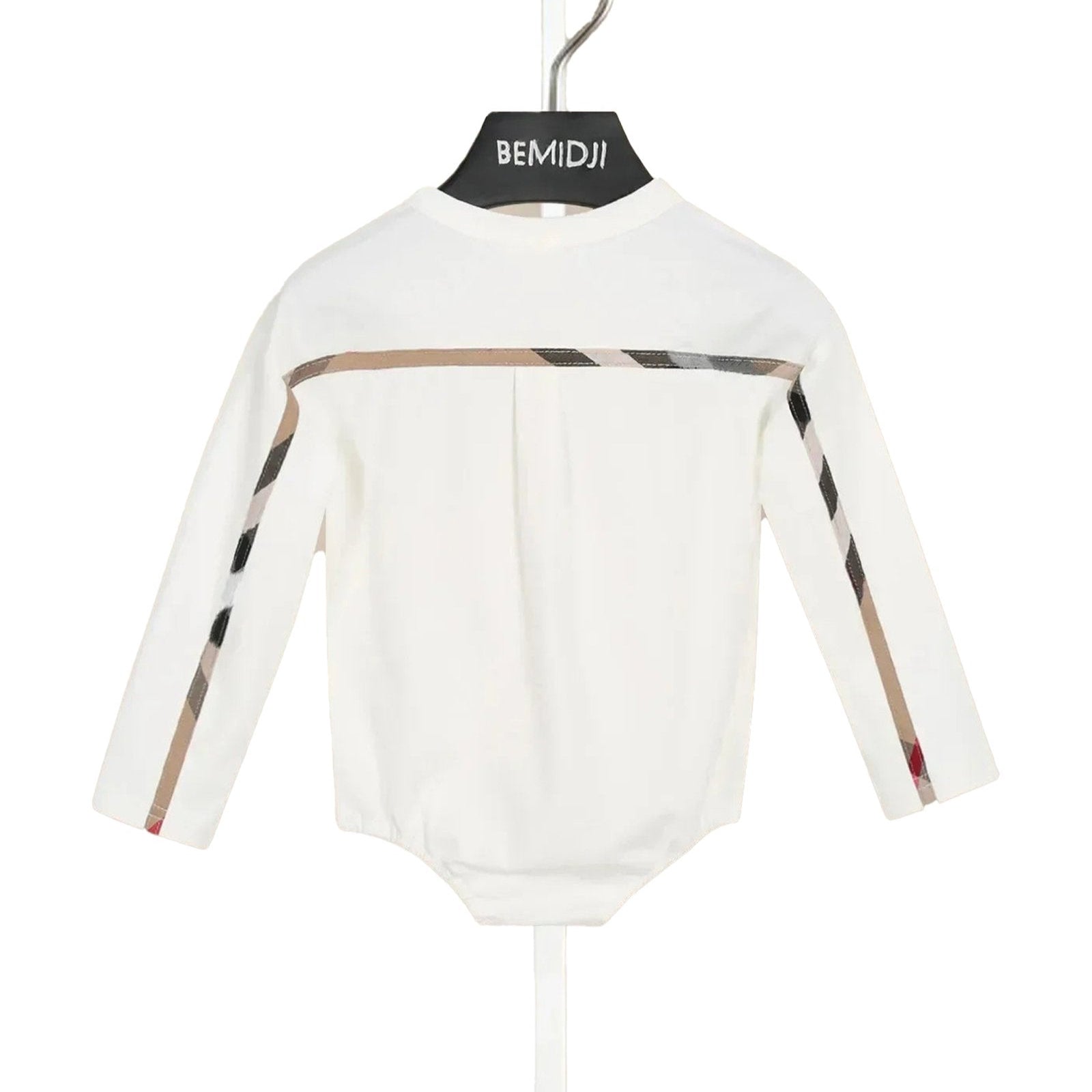 LuckeLadybug plaid romper baby clothes displayed on a hanger with matching shoes on the stand