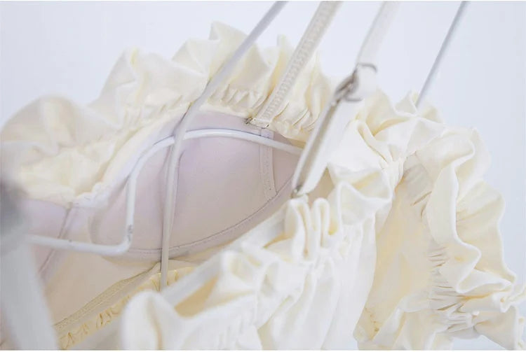 White beugel bikini set with ruffled edges and adjustable straps for a stylish beach look