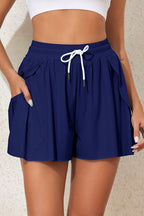Navy LuckeLadybug Boardshorts with Pockets, Ideal for Beach Outfits or Bikinis, Complementing Bikini Bottom