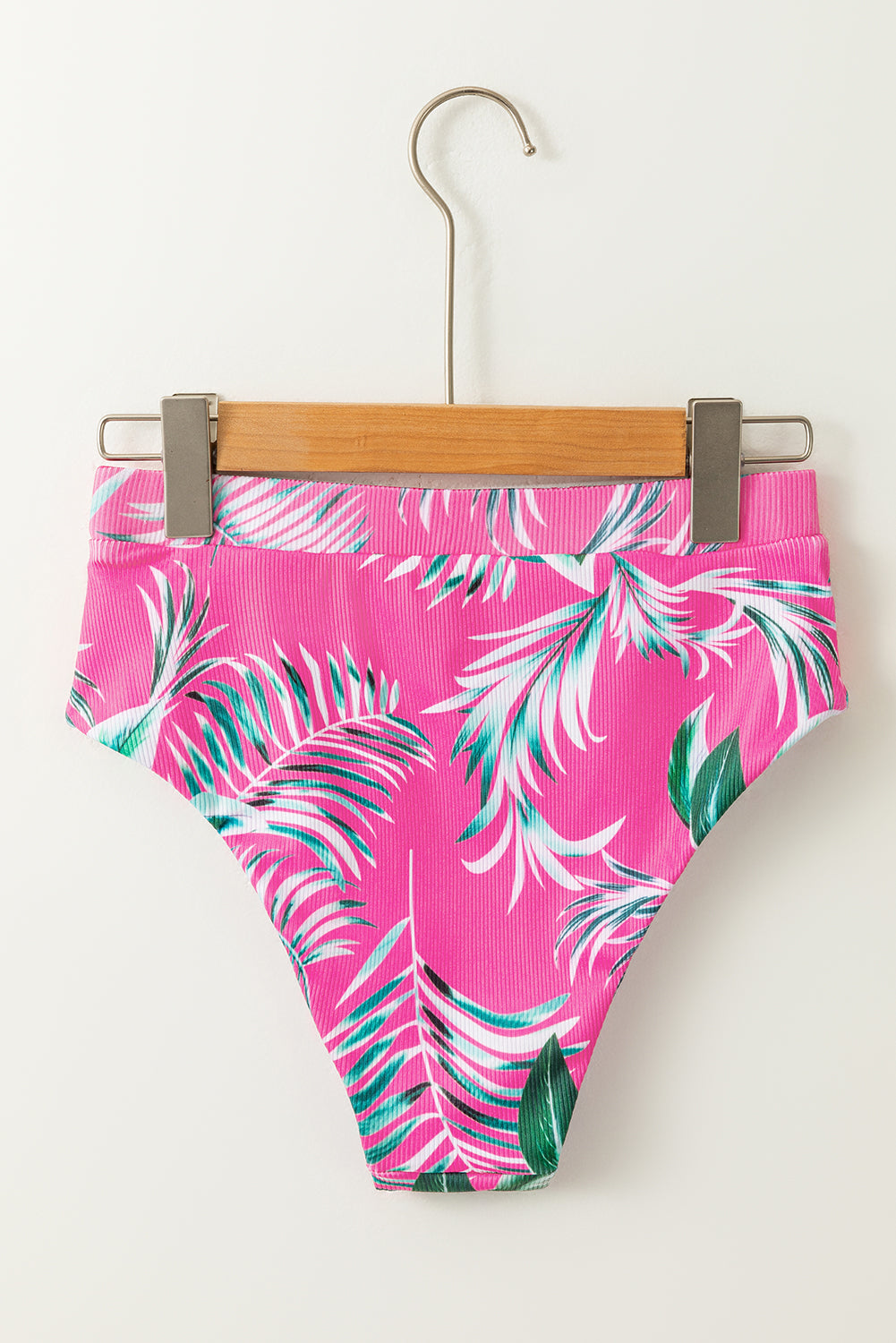Pink tropical print bikini bottoms with vibrant leaves for stylish summer beachwear