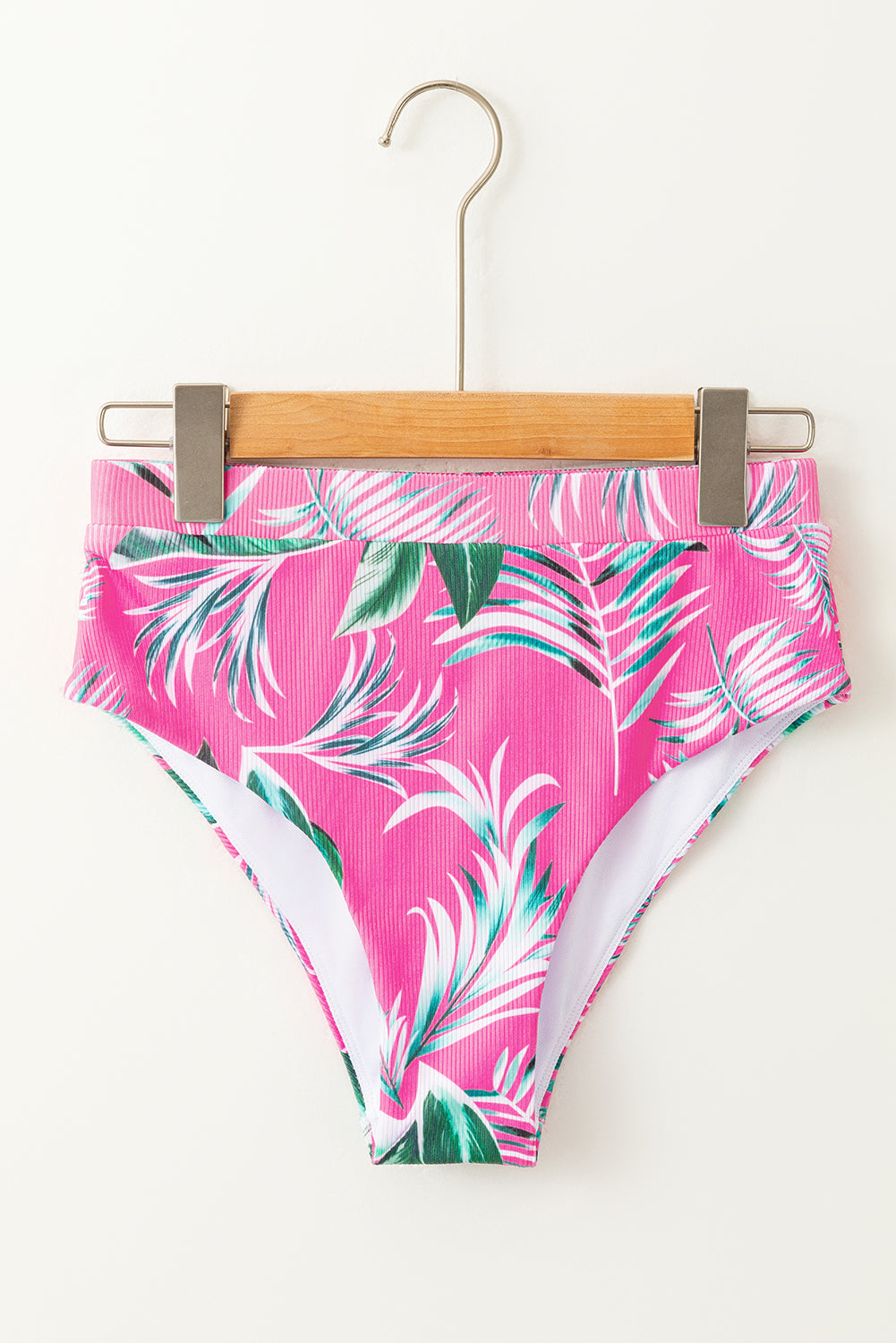 Pink bikini bottoms with tropical leaf print, perfect for summer beach days