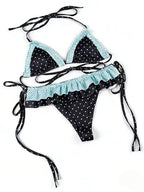 Polka dot bikini with high waist in black and turquoise, featuring ruffled details and adjustable ties