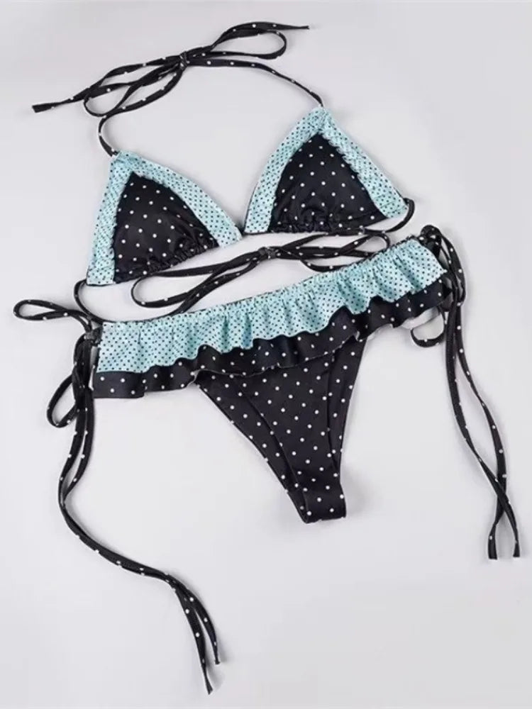 LuckeLadybug LLC bikini with high waist in black and blue polka dots featuring ruffled design and tie straps