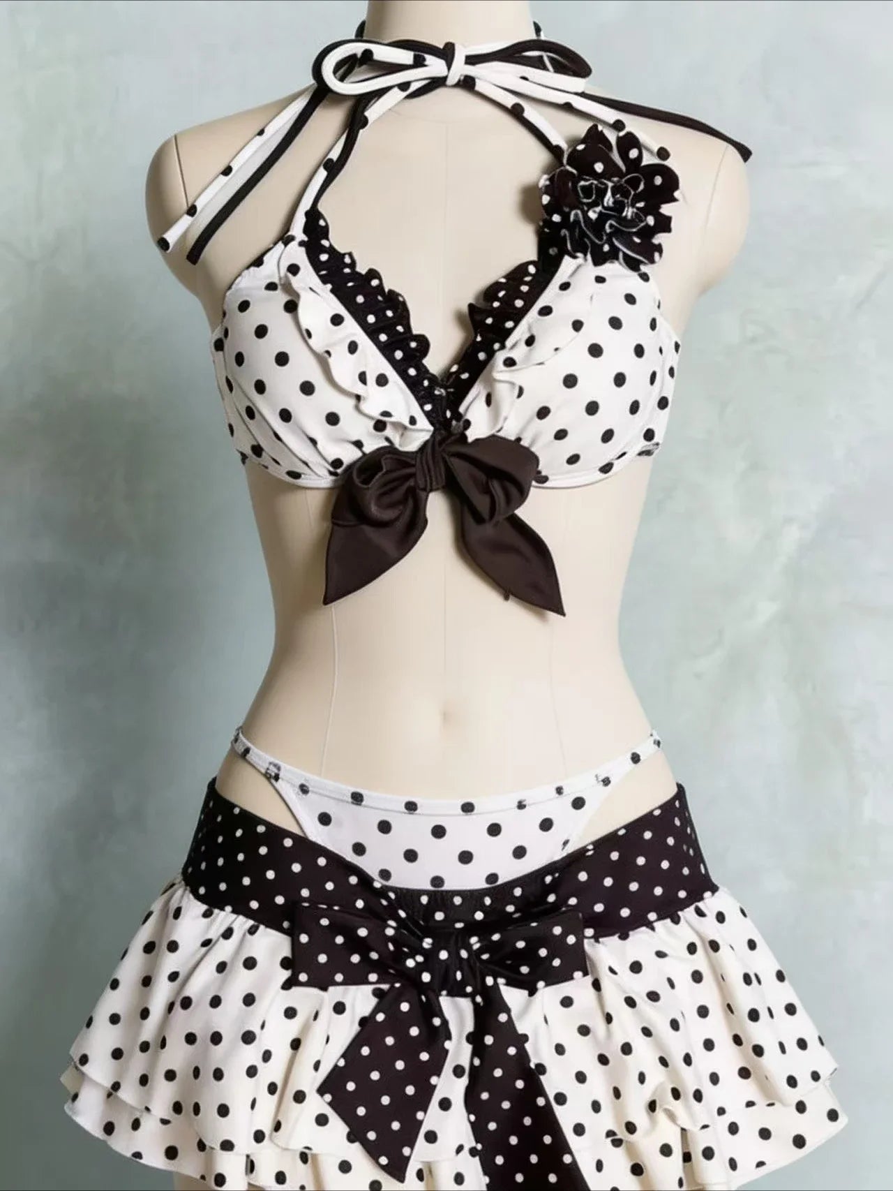 Polka dot bikini with high waist and bow details for stylish beachwear by LuckeLadybug LLC