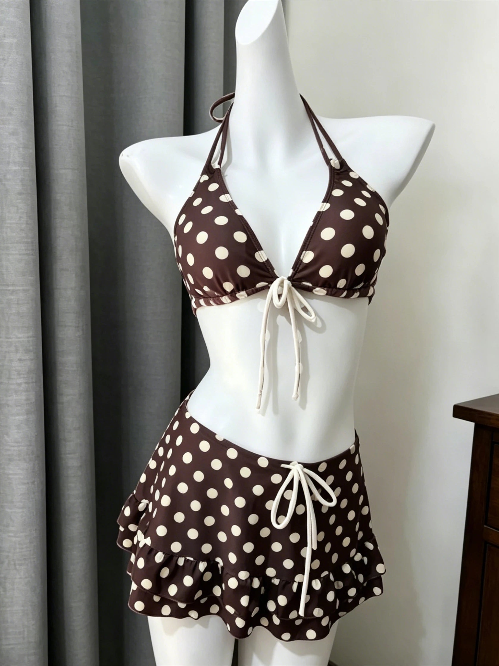 Brown polka dot bikini with high waist design and playful ruffle detail for stylish summer wear