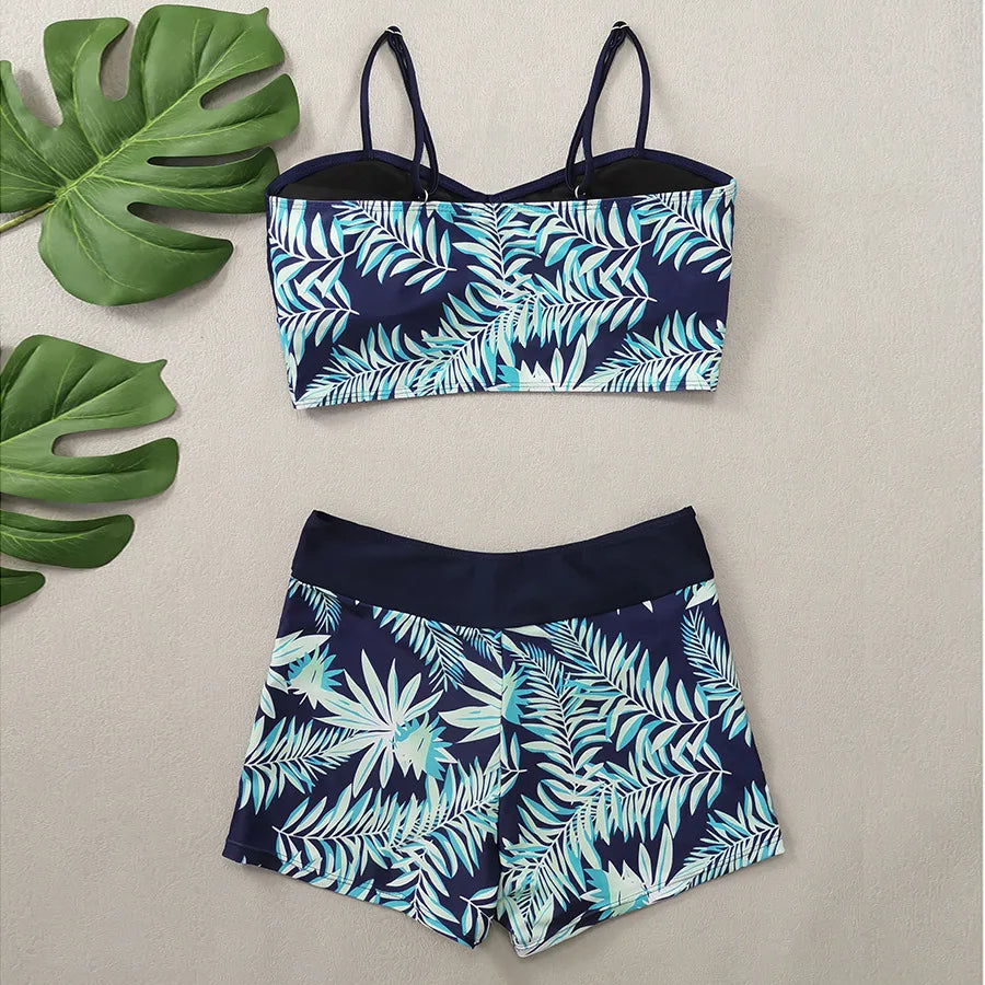 LuckeLadybug LLC bikini with high waist featuring a tropical leaf design in navy and mint green