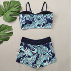 LuckeLadybug LLC bikini with high waist featuring a tropical leaf design in navy and mint green