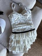 LuckeLadybug LLC bikini with high waist featuring polka dots and ruffled design for a stylish beach look