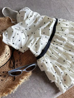 LuckeLadybug LLC bikini with high waist, featuring a ruffled design and polka dot pattern
