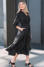 Black Fit & Flare maxi dress from LuckeLadybug LLC with puff sleeves and pockets
