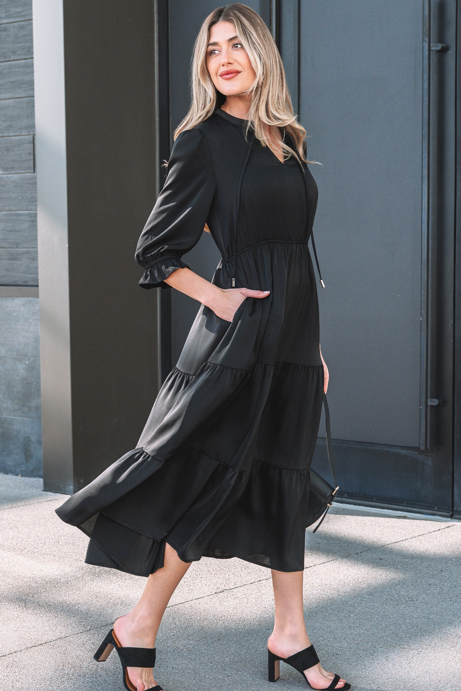 Black Fit & Flare maxi dress from LuckeLadybug LLC with puff sleeves and pockets