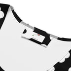 Close-up of neckline and label on LuckeLadybug black and white bodycon dress with polka dot design