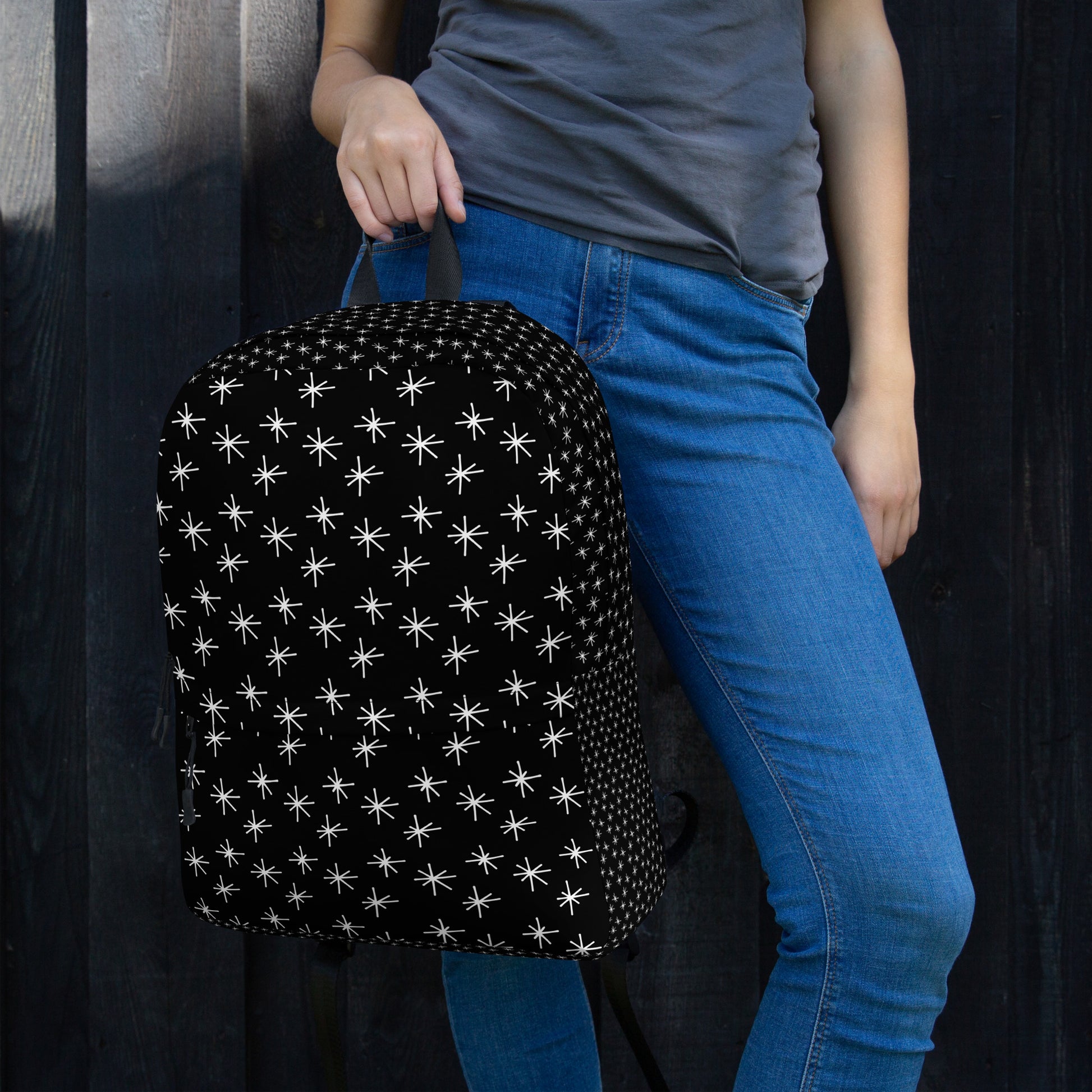 LuckeLadybug black backpack with white stars designed for stylish travel and daily use