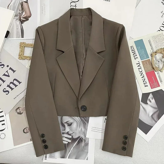 Stylish taupe cropped blazer featuring tailored design, perfect for pairing with various outfits as a black cropped blazer for women.