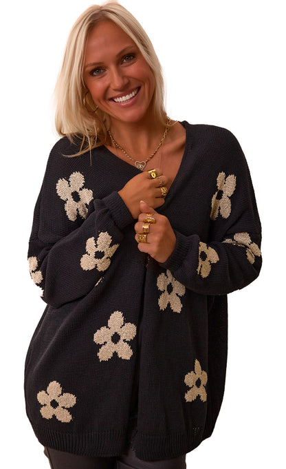 LuckeLadybug black floral knit cardigan featuring a relaxed fit and white flower pattern