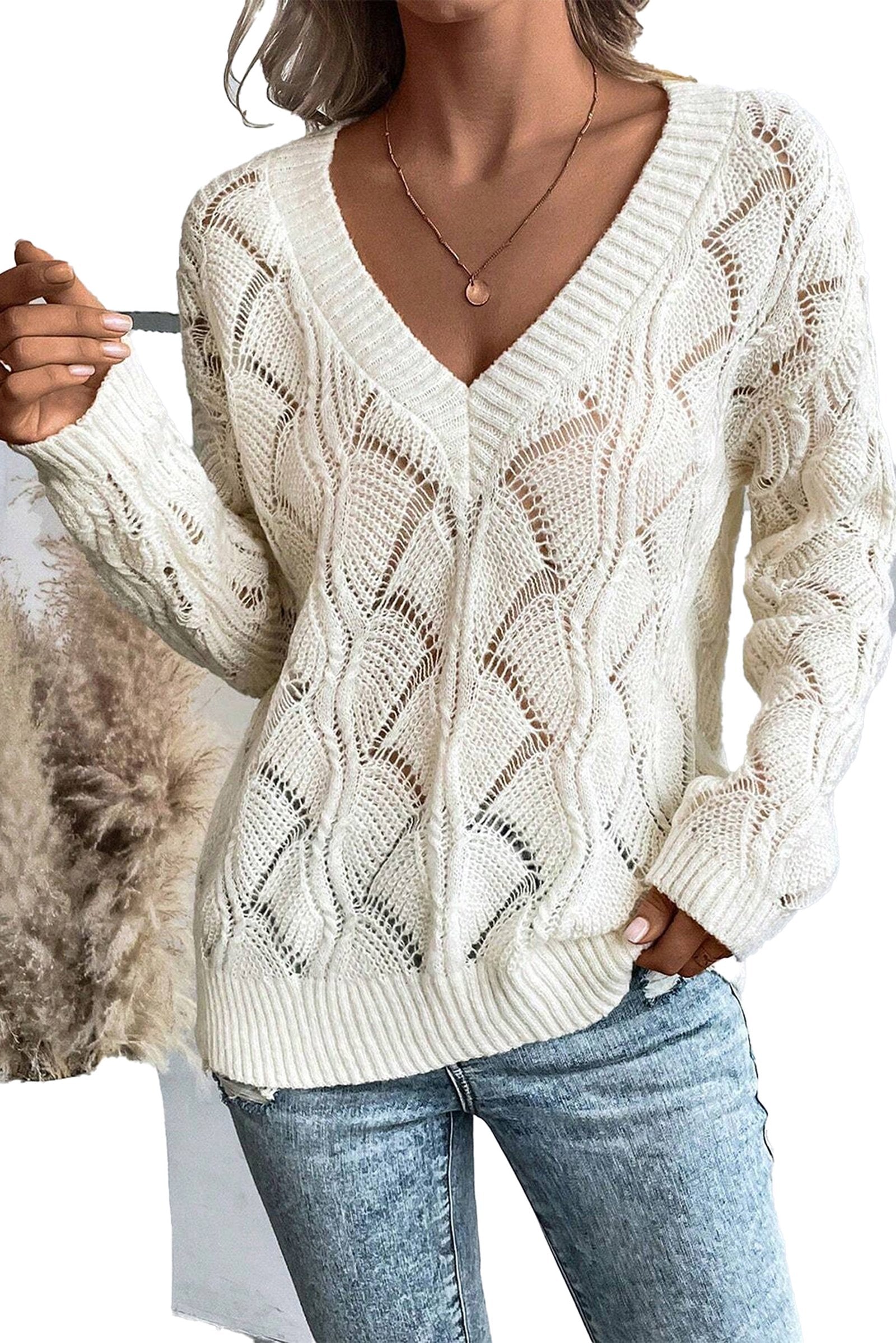 Black hollow out knit sweater with a stylish V-neck design and intricate patterns