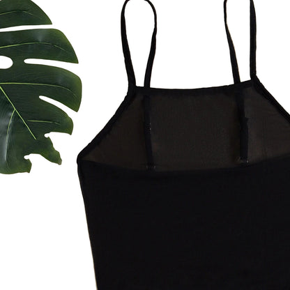 Black mesh beach cover up dress with adjustable straps against a leafy background