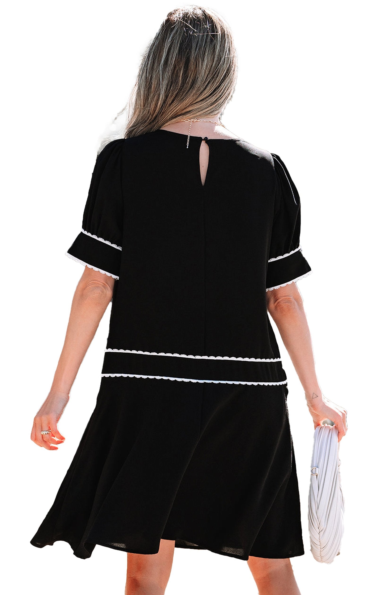 Back view of a LuckeLadybug black scallop trim dress with short sleeves and keyhole detail