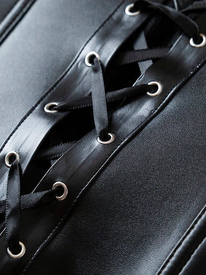 Close-up of a black strapless corset top featuring intricate lace-up details and sleek fabric
