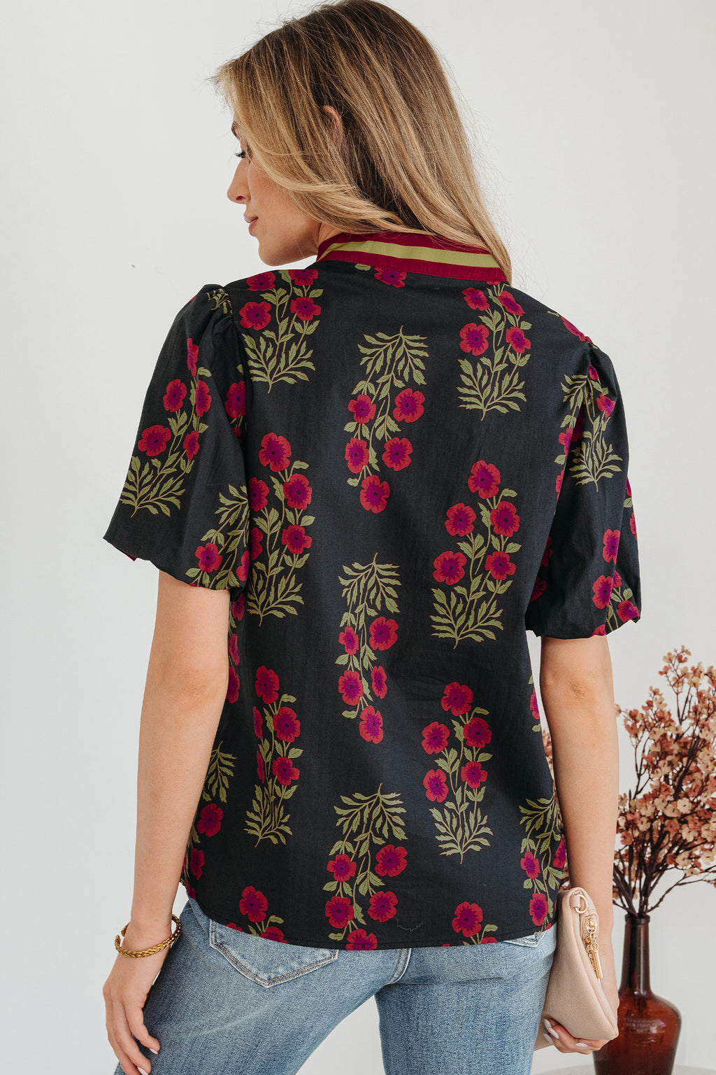 LuckeLadybug LLC floral blouse with short sleeves and a stylish collar featuring a vibrant floral pattern