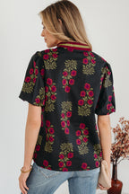 LuckeLadybug LLC floral blouse with short sleeves and a stylish collar featuring a vibrant floral pattern