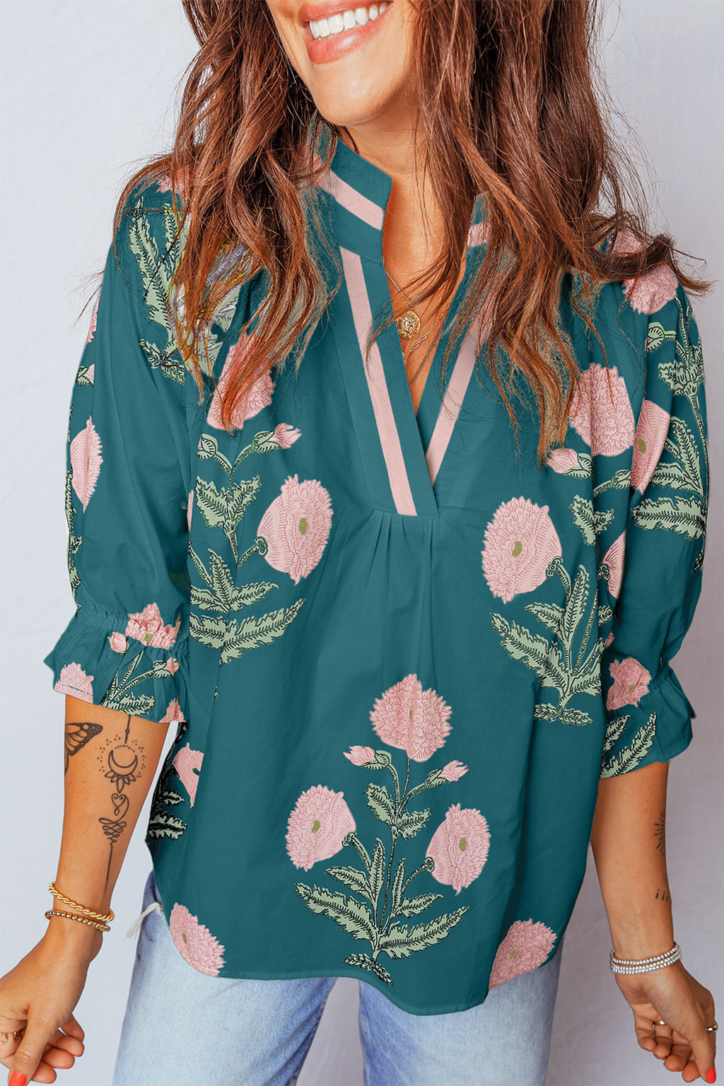 LuckeLadybug LLC blouse floral in teal with vibrant pink flower designs and a relaxed fit