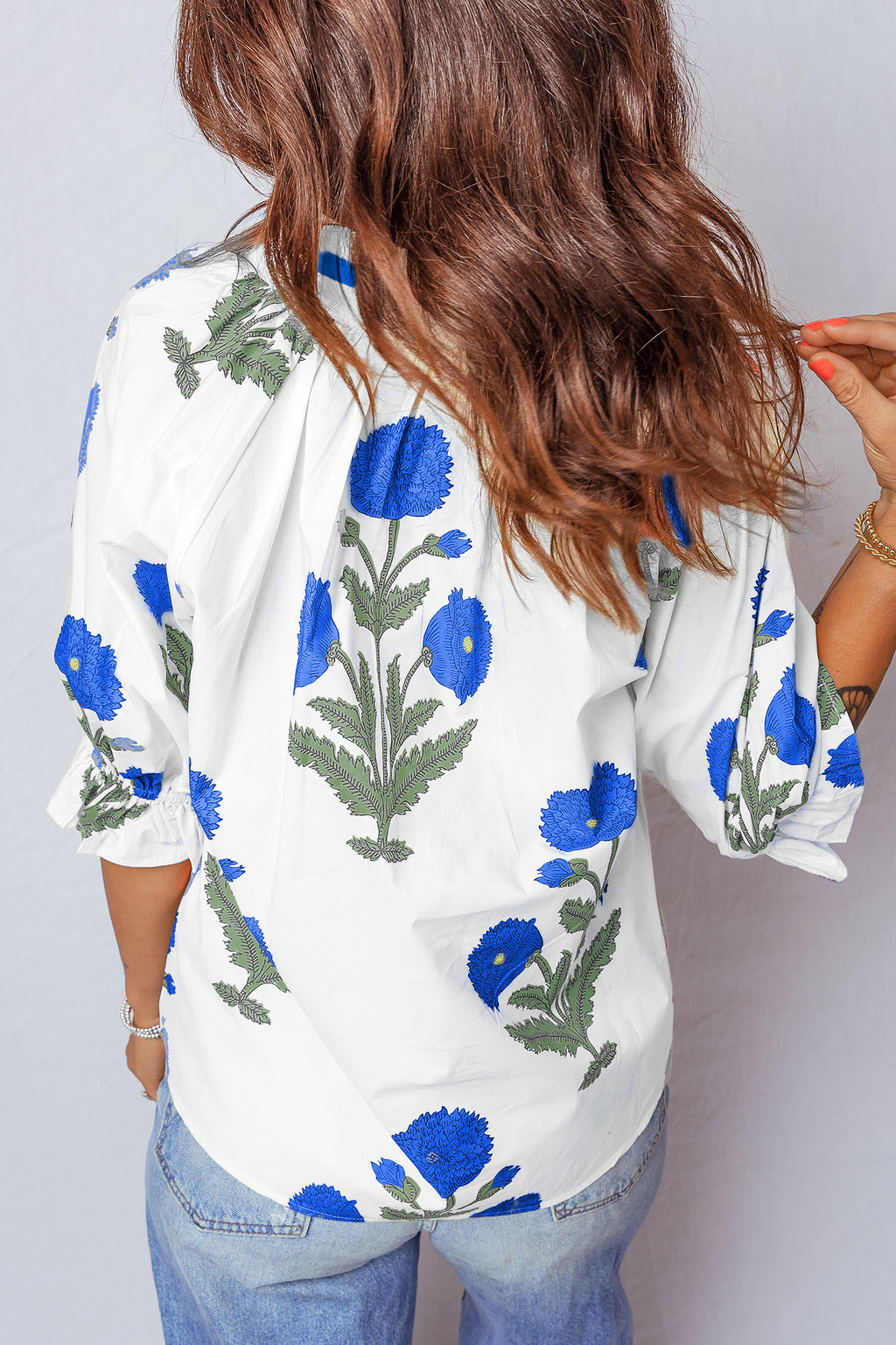 LuckeLadybug LLC women's blouse floral design in white with blue flower print and loose fit