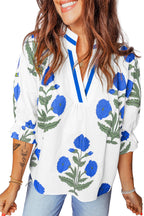 LuckeLadybug LLC floral blouse with blue flower prints and a relaxed fit, perfect for casual wear