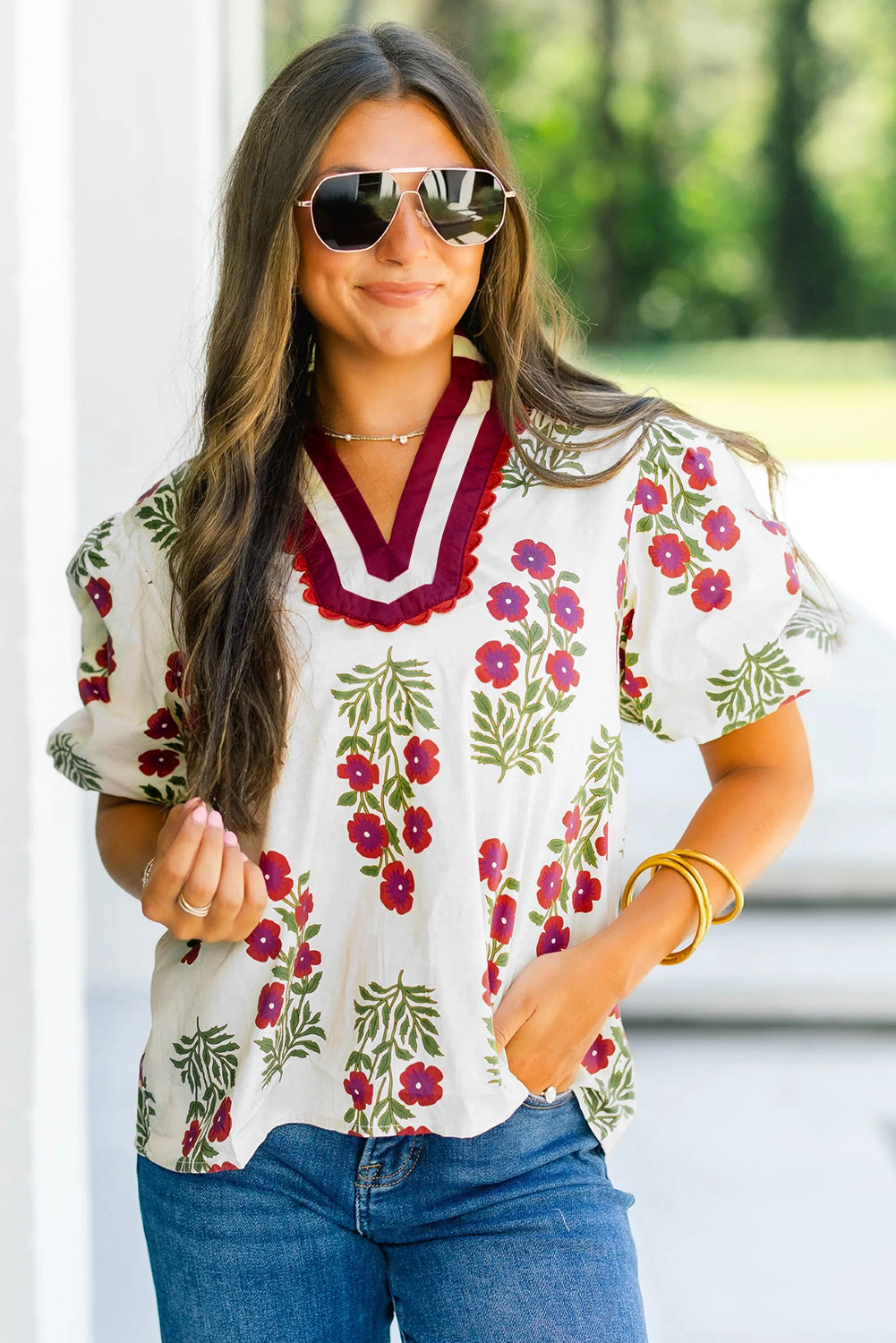 LuckeLadybug LLC floral blouse featuring vibrant floral design and stylish puff sleeves