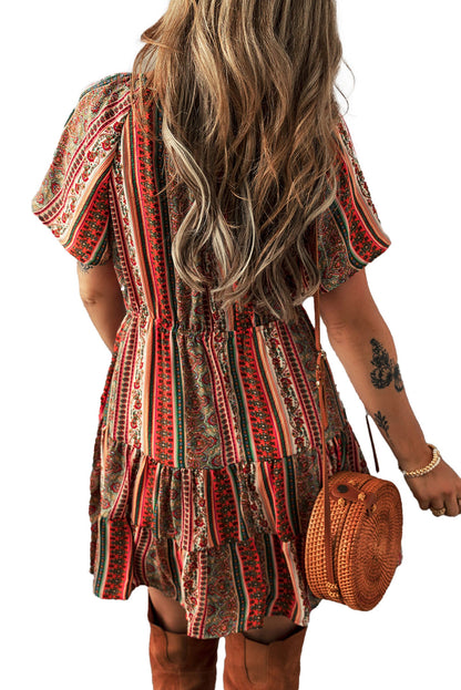 Bohemian floral print dress by LuckeLadybug with vibrant patterns and a tiered hem for a stylish look