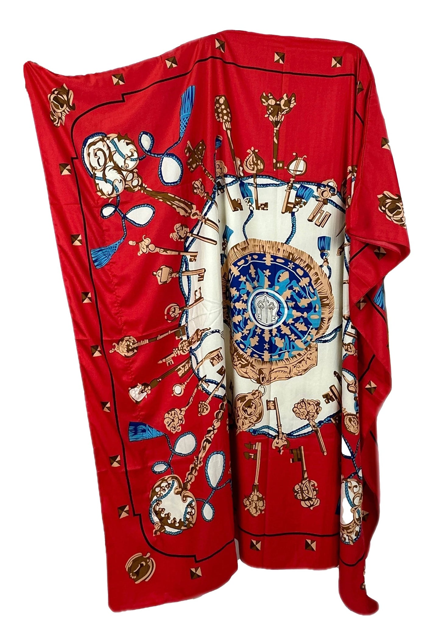 Cozy red blanket featuring a bohemian paisley print design with intricate patterns and symbols