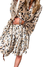 LuckeLadybug black leopard print dress tiered mini dress with long sleeves and gathered waist on model