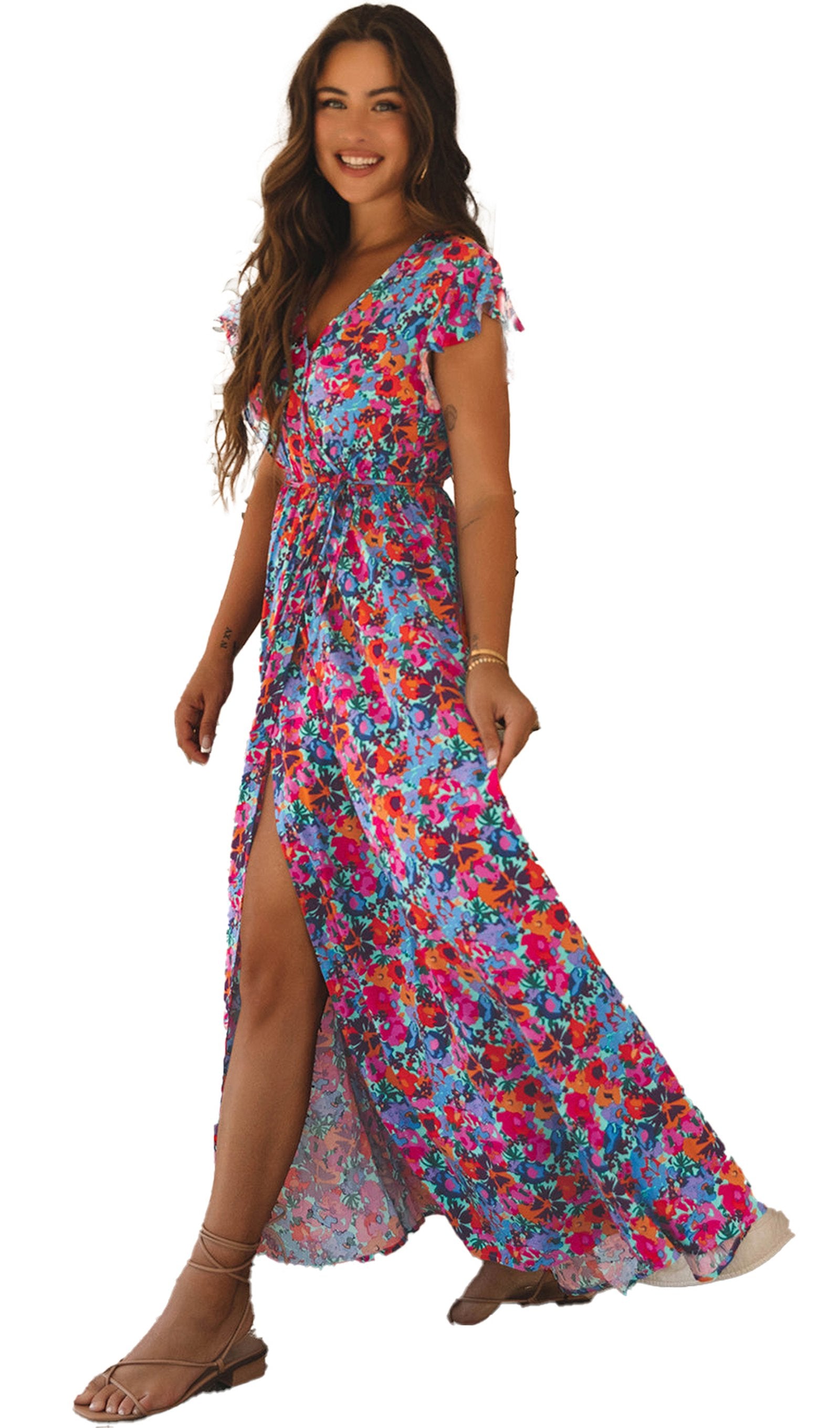 LuckeLadybug blue floral maxi dress on smiling model with v neck high slit flutter sleeves in boho living room
