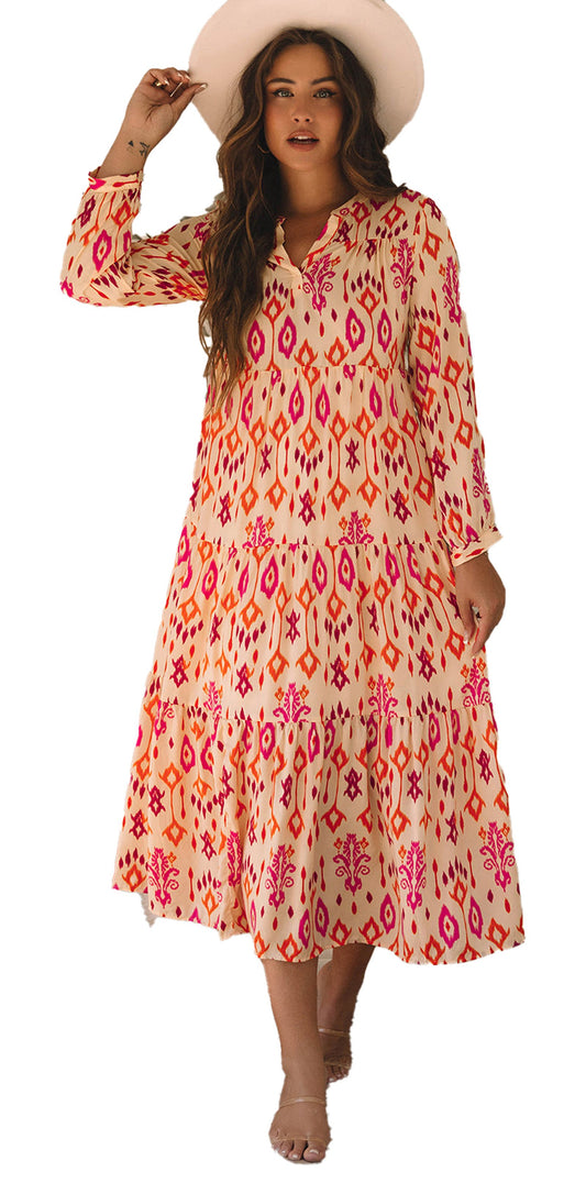 Model wearing orange geometric maxi dress with long sleeves straw hat and boho living room setting