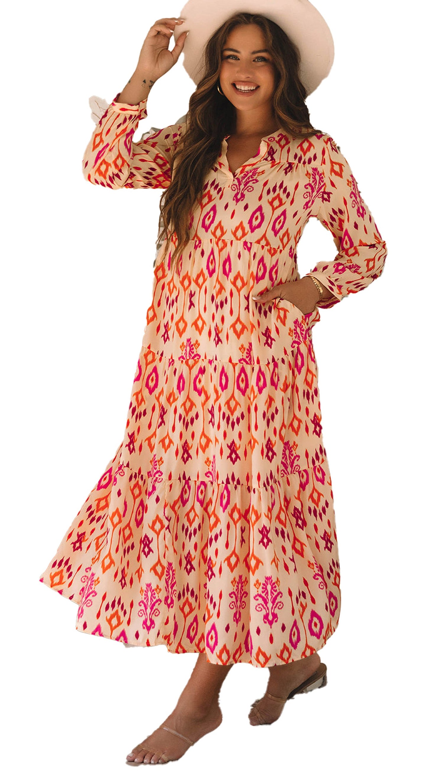 Model wearing Dear Lover Dropshipping orange geometric maxi dress with long sleeves v neck pockets and sandals