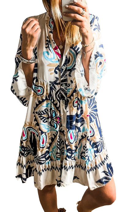 Woman wearing LuckeLadybug white tribal print mini dress with bell sleeves and V neck mirror selfie