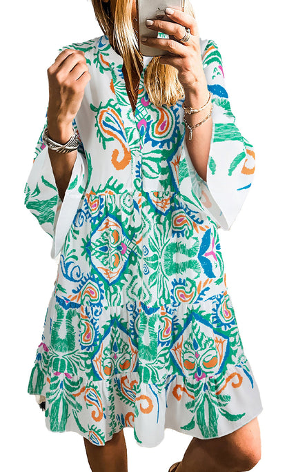 white tribal print mini dress with vibrant green blue and orange motifs v neck bell sleeves and tiered skirt