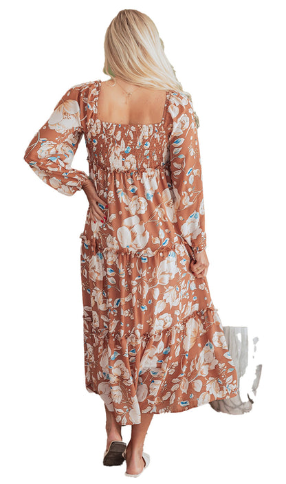 Rear view of woman in brown floral maxi dress with smocked square back long sleeves and tiered skirt
