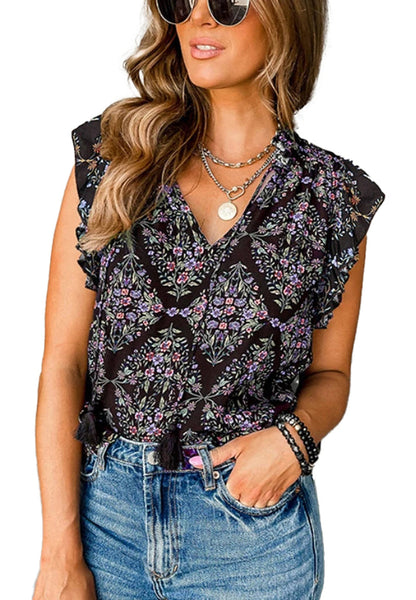 Stylish woman wearing a boho floral sleeveless blouse with ruffled sleeves and floral patterns