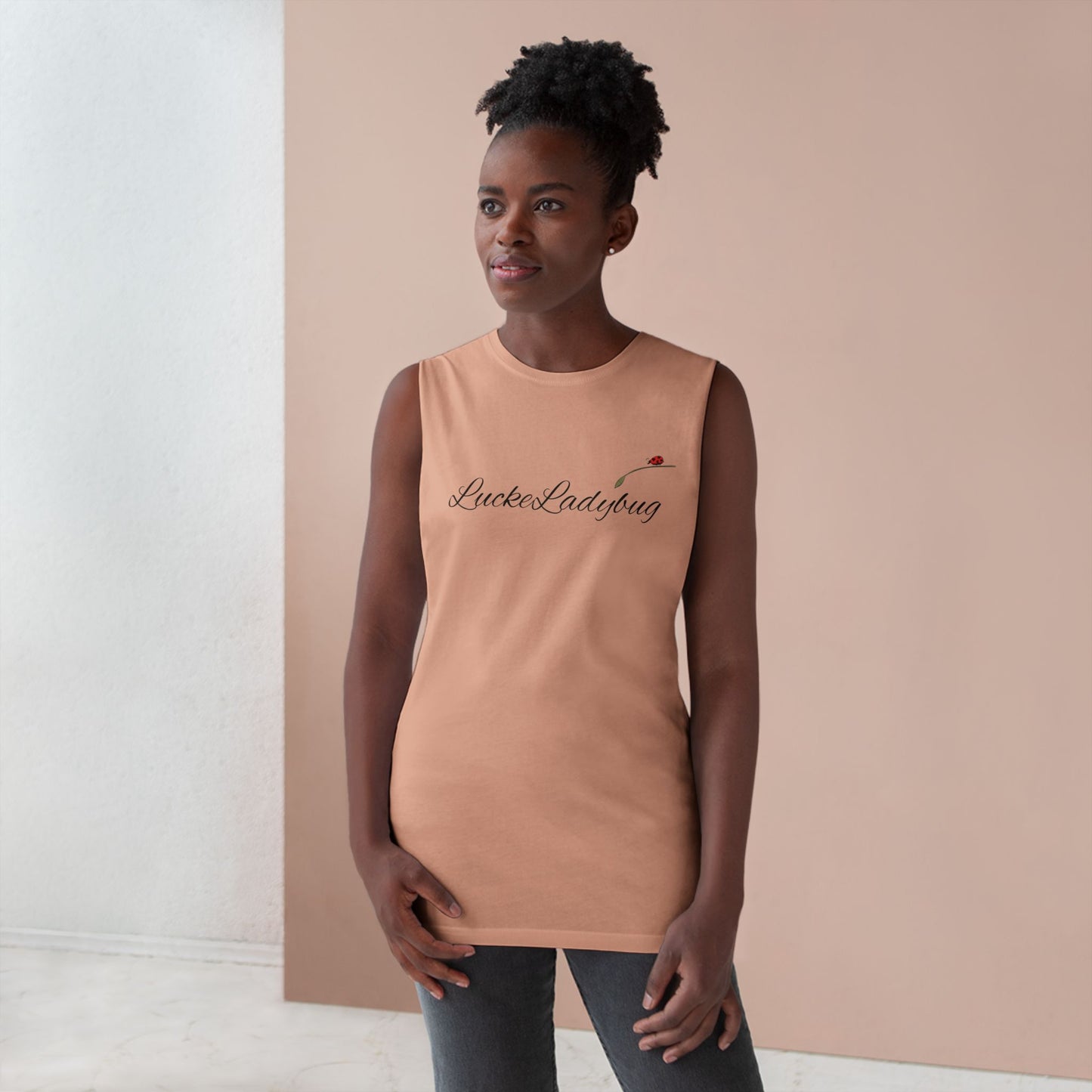 LuckeLadybug bold ladybug print tank in tan worn by woman with natural hairstyle