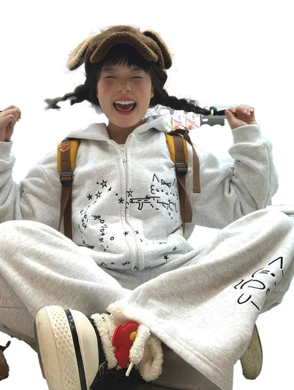 Cute embroidered hoodie for women in gray paired with cozy matching pants for a casual look