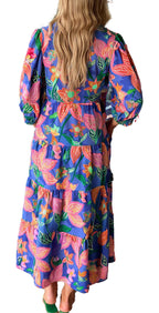 LuckeLadybug blue floral print long dress with puff sleeves and tiered maxi skirt shown from back in boutique