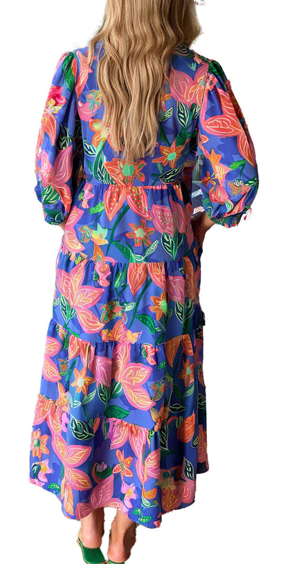 LuckeLadybug blue floral print long dress with puff sleeves and tiered maxi skirt shown from back in boutique