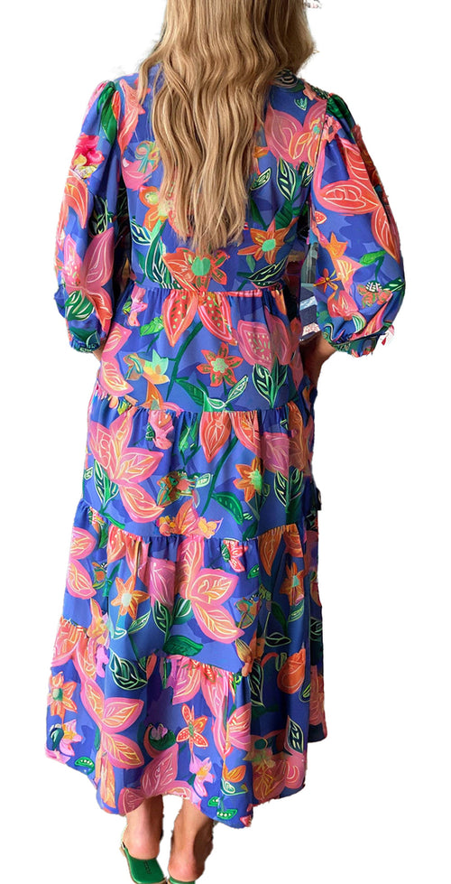 LuckeLadybug blue floral print long dress with puff sleeves and tiered maxi skirt shown from back in boutique