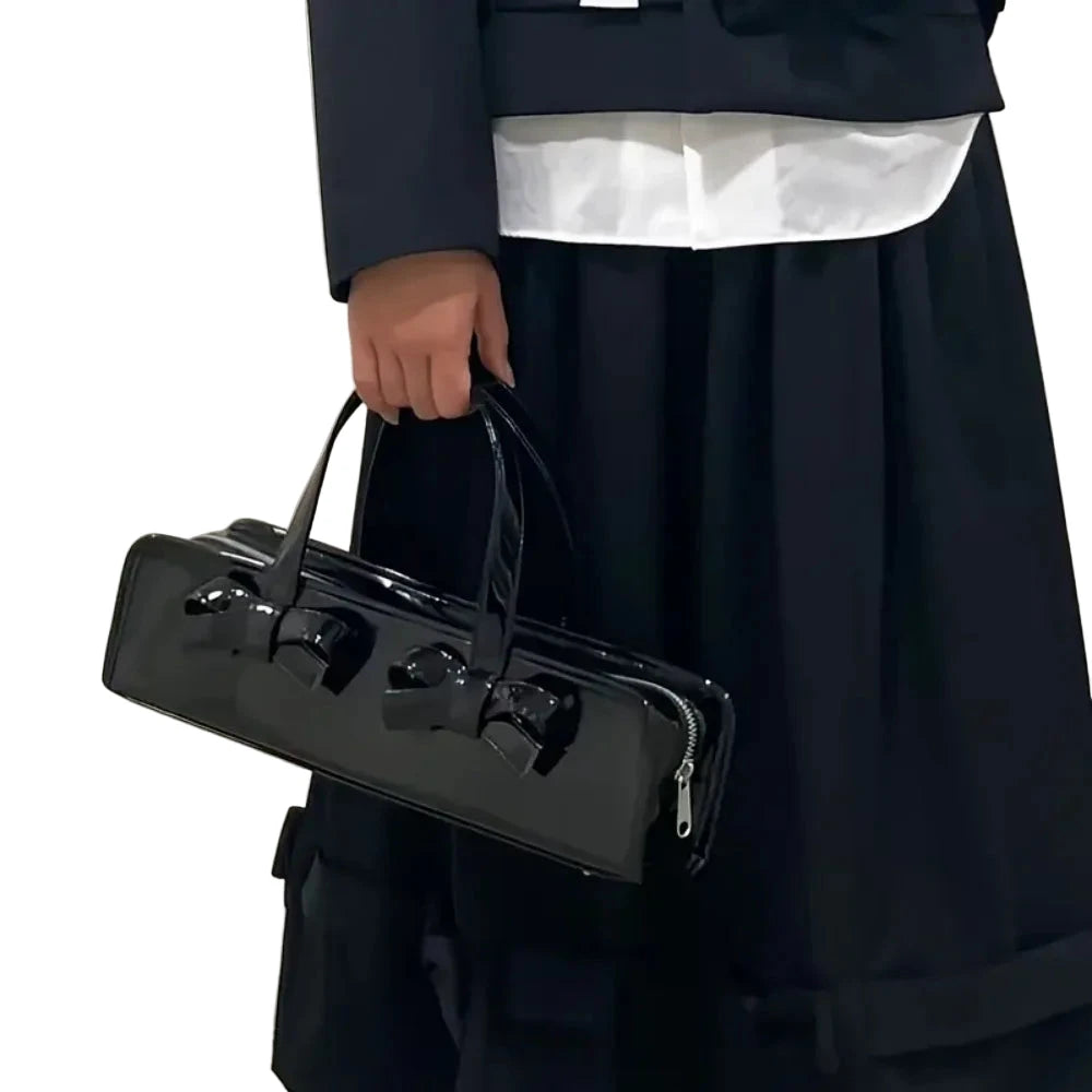 Elegant black bow handbag for women with dual bow details and a sleek design