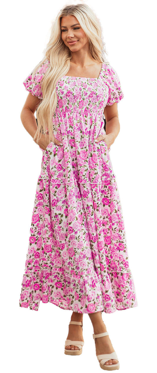 Woman wearing LuckeLadybug pink floral smocked dress A line maxi with square neckline puff sleeves and pockets