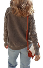 Back view of a blue cable knit sweater for women with trendy textured sleeves